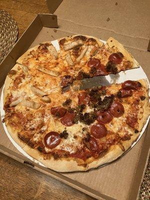 Cheese Pizza with half pepperoni and sausage, half chicken