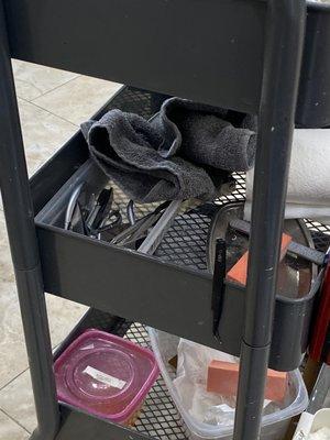 Dirty tools on a dirty tray - he tried to use these tools on me! Someone else's toenails were on the tray and the nail file.