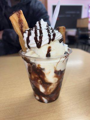 Churro with rum raisin ice cream