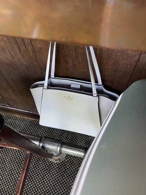 Another tip, the bar has hooks for your purse/bag!