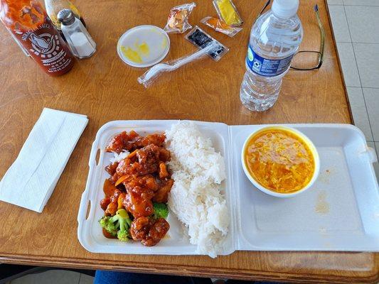 Lunch Special. Orange chicken with steamed rice and egg drop soup. Add a bottle of water to drink. Total $9.58 on 19 April 2024.