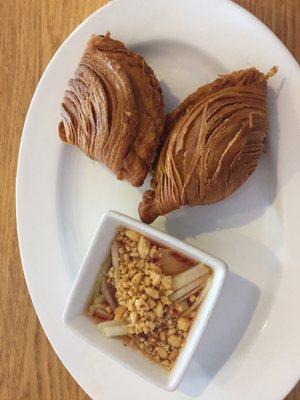 Curry puffs, similar of the samosa found in a Indian restaurant, but with a different fluffier outside.