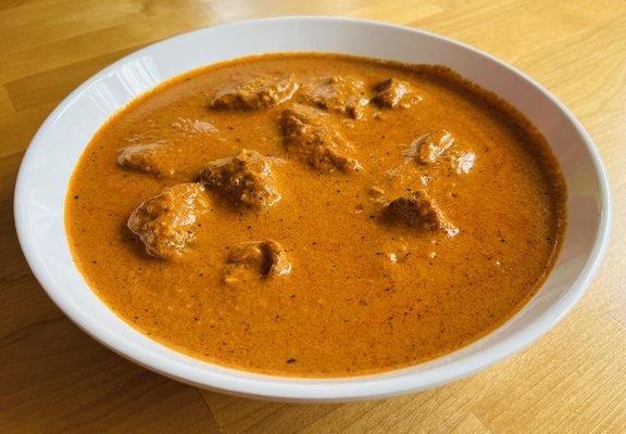 Chicken Tikka Masala: Bonesless chicken cooked in creamy tomato sauce and spices. Contain cashew nuts.