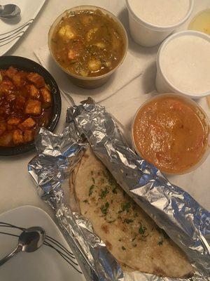 Chili Paneer (Gluten Free), Garlic Cilantro Naan, Aloo Gobi (Vegan) (Gluten Free), Butter Chicken (Gluten Free)