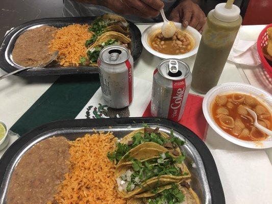 2 lunch specials.. 3 tacos, rice, beans, can soda and free bowl of beans or sopa. $19 and some change total. Great service..