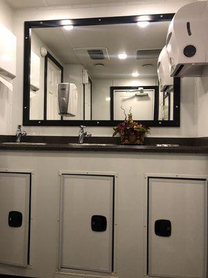 Restroom trailer vanity and sinks