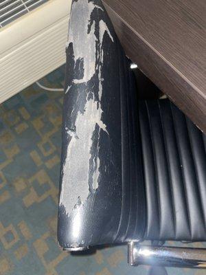 Vinyl flaking on the desk chair.