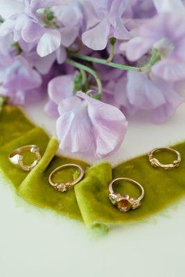 Custom made sapphire engagement rings with hand cast wedding band accents. Photography via Madeline Barr