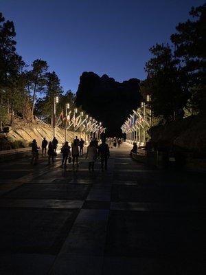 Avenue of Flags at dusk with dark monument in backdrop