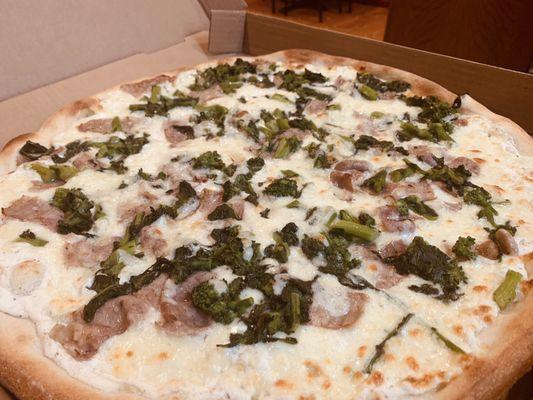 White pie with sausage and broccoli rabe