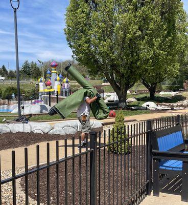 Workers busily walking to & from the parking lot thru the outdoor play area