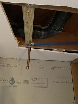 Rainhead shower mounted below the framing members which means there would be a nasty belly in the drywall patch.