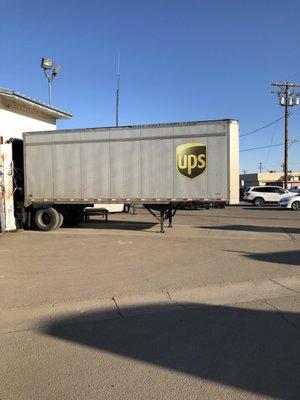 Trucks bringing and taking packages