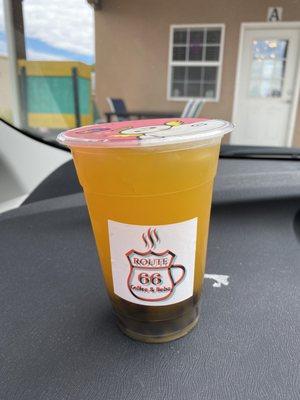 Mango green tea with rock hard boba.