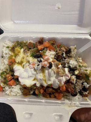 Steak bowl with white rice, black beans, pico de gallo, queso, sour cream, and medium salsa