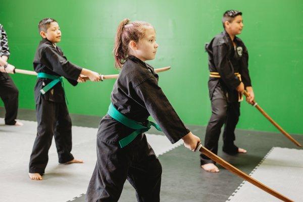 Learning sword at a special workshop.