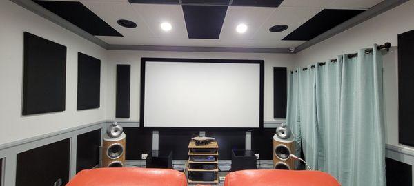 A view of our theater room display including a high end JVC projector and Premium in-wall Origin Acoustics speakers.