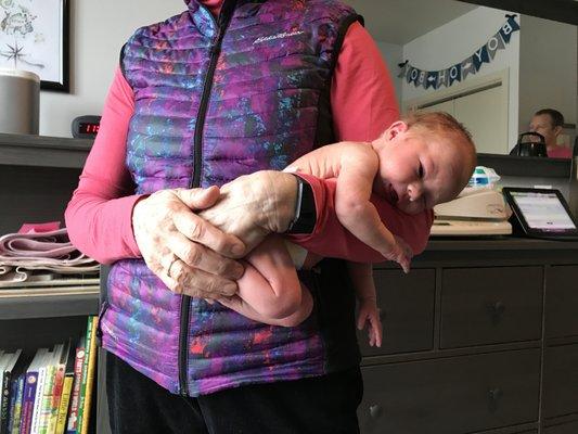 Jane demonstrates the "colic carry"