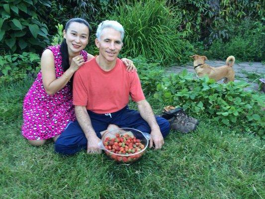 Paul and his wife Meme, with a strawberry harvest from the garden.