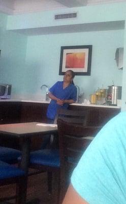 Days Inn worker in charge of breakfast area.  She was less than attentive and not very helpful.