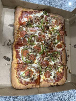 Sicilian Pizza with sausage, pepperoni, green peppers, onions and mushrooms