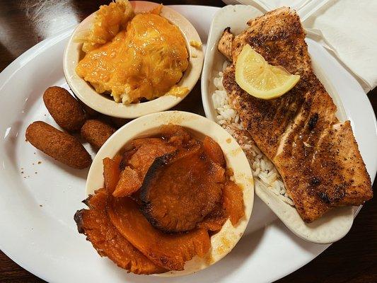 Grilled salmon with hush puppies, yams, and Mac and cheese