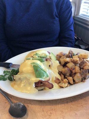 Eggs Benedict with Bacon and Avocado with home fries. Wife says it was delicious.