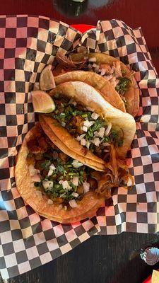 Taco trio with carnitas, birria and al pastor