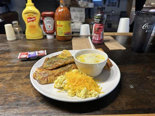 Grilled Talpia 2 pieces scrambled eggs with cheese grits and toast