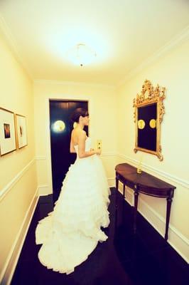 Bride looking in mirror.