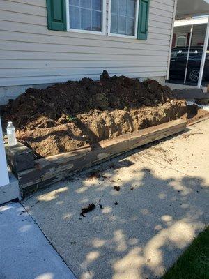 I took the timbers out and make a beautiful  retaining  block wall