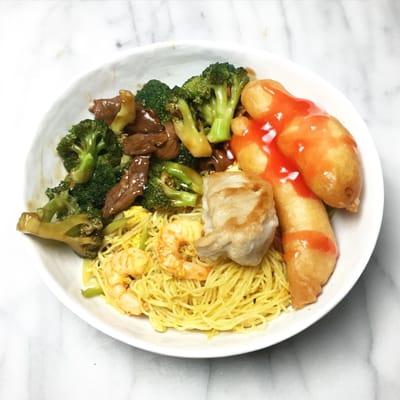 Singapore noodles, beef and broccoli, sweet and sour chicken, and a dumpling.