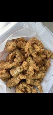 Fried cat fish nuggets, fried shrimp, and hush puppies.