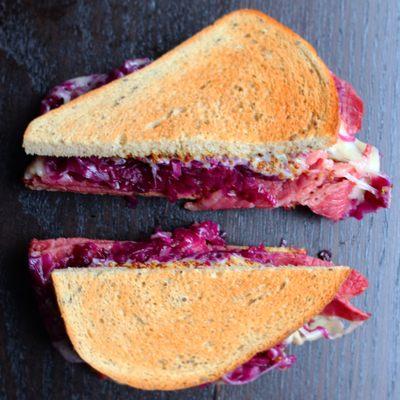 Chicago style corned beef sandwich with braised red cabbage and whole grain mustard on rye.