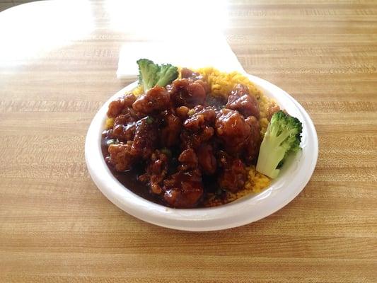 The plate of General Tso's chicken, rice and broccoli is stacked high