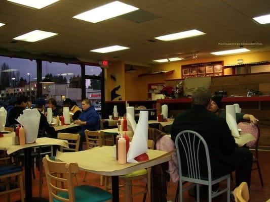 Interior of restaurant with happy patrons.