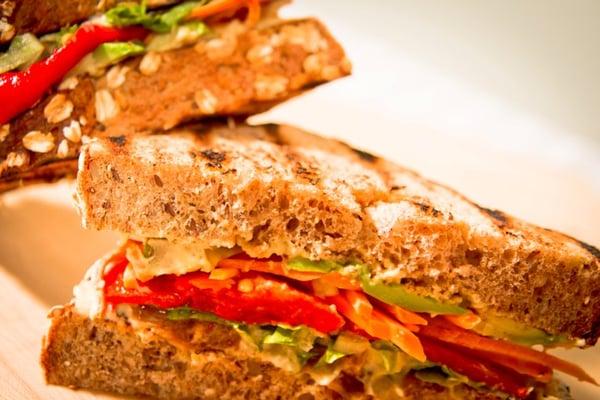 Avocado, hummus, carrot, roasted pepper, Sicilian onions, shaved romaine on toasted 7-grain (vegan)