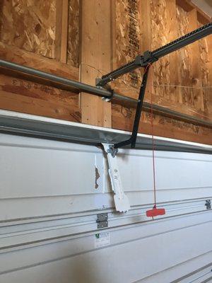 Broken Bracket. Garage Door Repair Service. Anytime Garage Door.