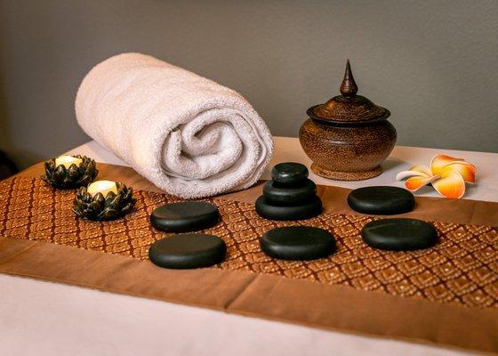 Hot stone massage helps relaxation and ease tense muscles.