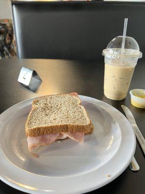 Ham and Swiss on wheat. Iced latte.