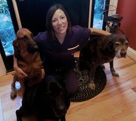 Dr. Eavers with her three dogs Copper, Clyde, and Harlan.