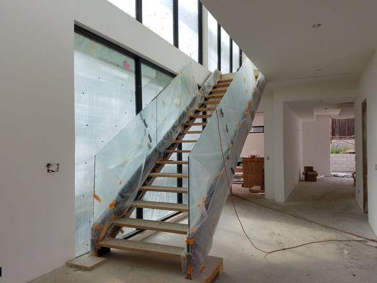 Glass railing with wood stairs