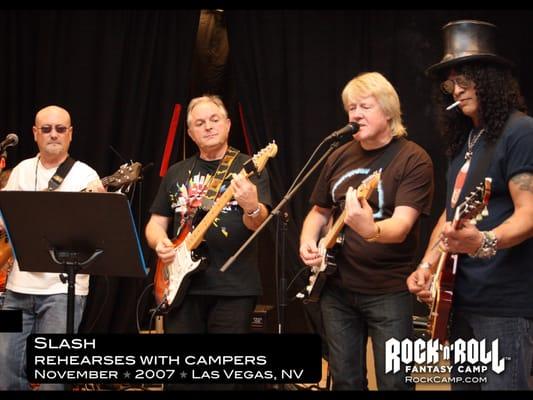 Slash jams with campers in their rehearsal studio