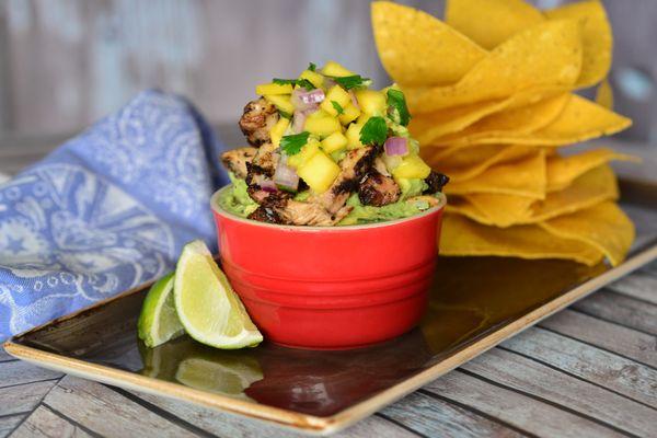 Juicy jerk chicken and pineapple on top of our fresh made guacamole.