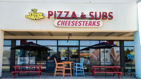 Yellow Submarine Pizza & Subs & Cheesesteaks Storefront with outdoor seating at the Outer Banks Mall in Nags Head, North Caro...