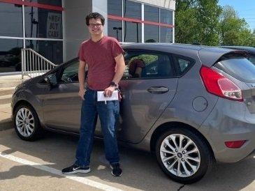 Myself, infront of my car on the date of purchase.