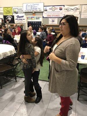 Parents, teachers and volunteers working the fish fry.