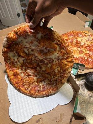 Unsliced cheese pizza.