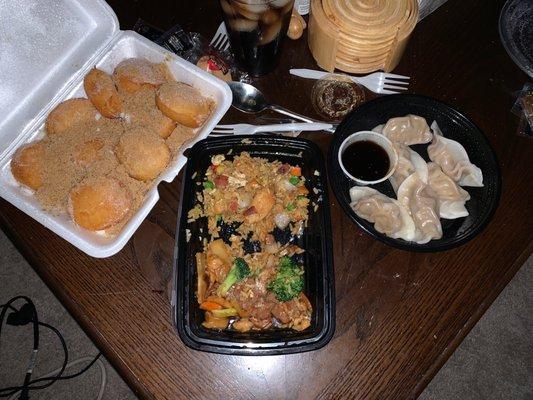 Chicken and broccoli with pork fried rice, started eating already-steam dumplings with ginger sauce and for dessert fried donuts