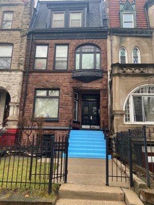 Front view of building post-roofing, masonry and tuck pointing.